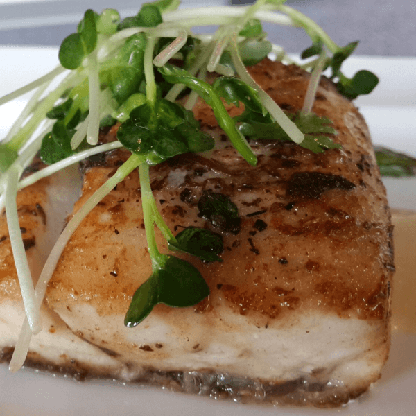 lightly fried fish with watercress